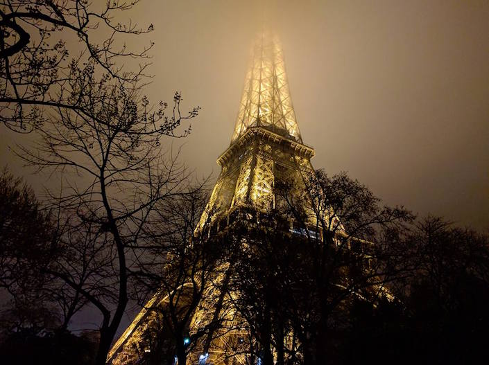 Eiffel Tower at night in fog