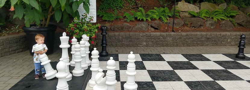baby playing giant chess